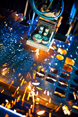 Laser cutting with sparks close up