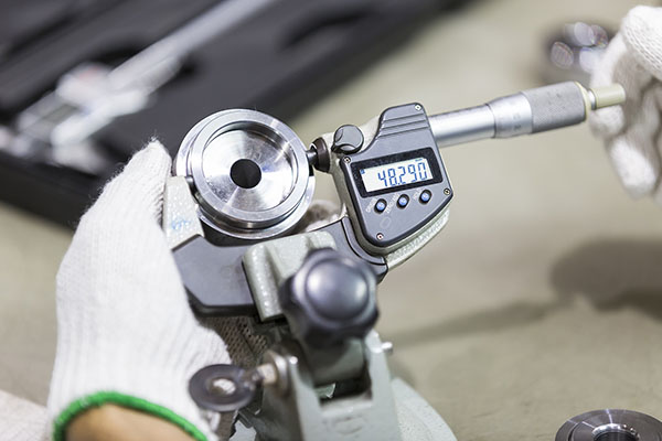 Operator Inspection Automotive Part By Micrometer